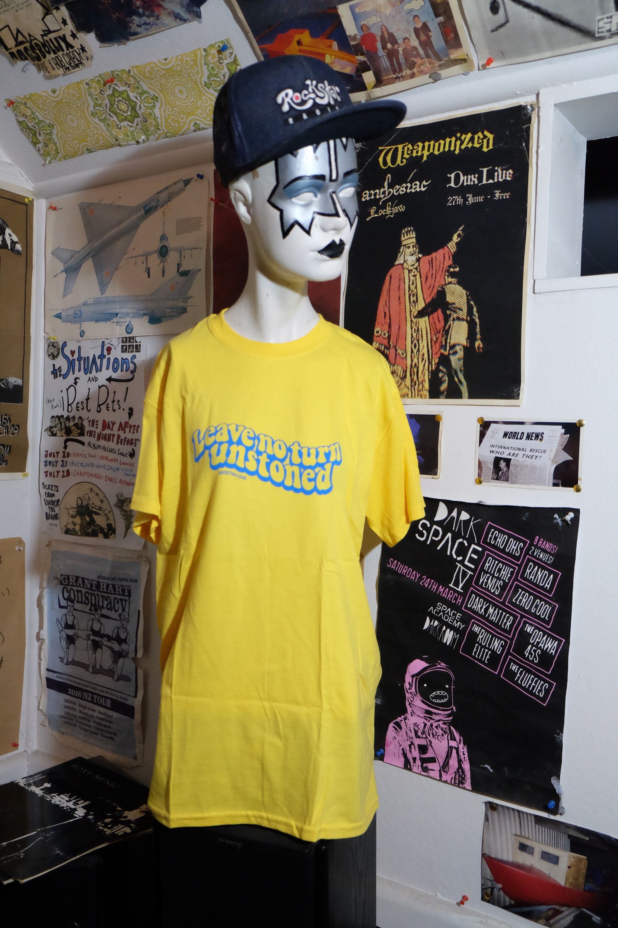 Yellow Rockstar Racing t-shirt with blue leave no turn unstoned print.