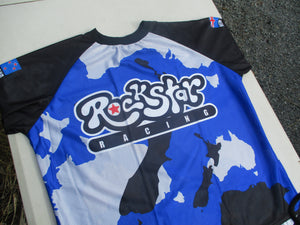 A Yamoto blue NZ made Rockstar anzac camouflage dh top on a table.